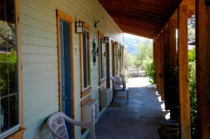 a porch of a house with chairs on it at The Inn of Escalante in Escalante