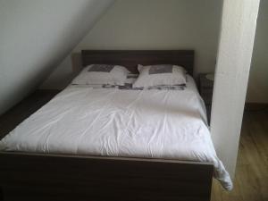 En eller flere senge i et værelse på Appartement Rue Georges V - Port de la Houle