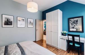 Posteľ alebo postele v izbe v ubytovaní Monarchia Apartman Grand