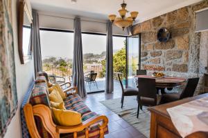 a living room with a couch and a table at Partezins III in Castelo de Paiva