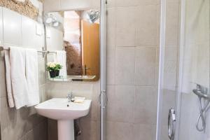 a bathroom with a sink and a shower at Partezins III in Castelo de Paiva +14 photos