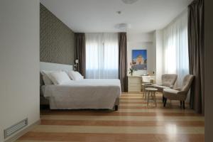 Posteľ alebo postele v izbe v ubytovaní Hotel Portavaldera