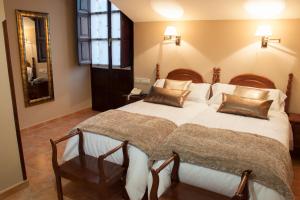 מיטה או מיטות בחדר ב-Hotel Rural Entremontes