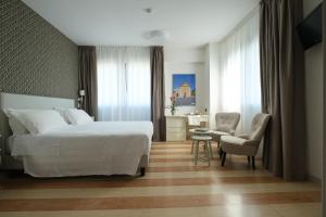 Posteľ alebo postele v izbe v ubytovaní Hotel Portavaldera