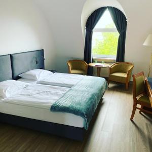 Ein Bett oder Betten in einem Zimmer der Unterkunft Skycity Hotel Atrigon