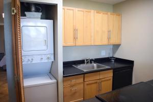 a kitchen with a white refrigerator and a sink at Beautiful Private Condo Walking Distance to Beach MV2321 in Kihei