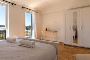Postel nebo postele na pokoji v ubytování Charming tale apartments Modun19