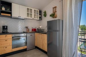 Kuchyň nebo kuchyňský kout v ubytování Charming tale apartments Modun19