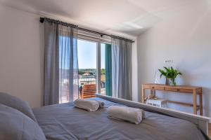 Postel nebo postele na pokoji v ubytování Charming tale apartments Modun19