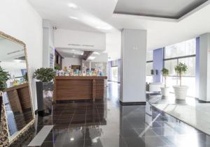 a lobby with a counter in a building at Praia da Rocha Apartments in Portimão