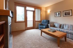 a living room with a couch and a table at Columbia West condo in Hood River +15 photos