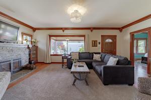 a living room with a couch and a fireplace at Classy Craftsman in Arcata