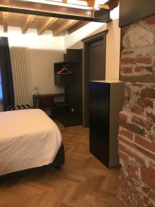 A bed or beds in a room at Hotel Dal Menga
