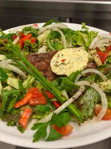 a plate of food with meat and vegetables on it at Der Tanzhase in Hasenmoor