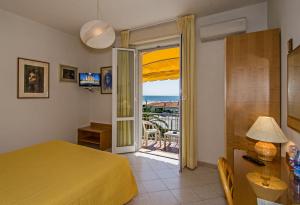 Postel nebo postele na pokoji v ubytování Hotel Alk