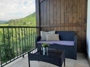 A balcony or terrace at Apartamentos El Llanin
