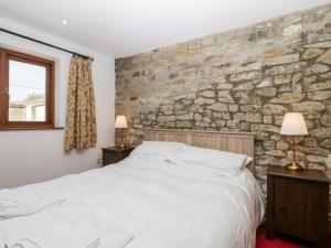 Uma cama ou camas num quarto em The Stone Barn