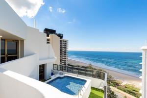 a balcony with a plunge pool and a view of the ocean at Ocean Royale in Gold Coast