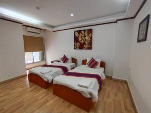 Postel nebo postele na pokoji v ubytování WeRest Hotel