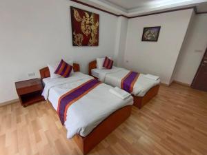 Postel nebo postele na pokoji v ubytování WeRest Hotel
