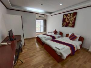 Postel nebo postele na pokoji v ubytování WeRest Hotel