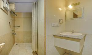 a bathroom with a sink and a shower at Treebo Savoury Sea Shell Residency in Bengaluru