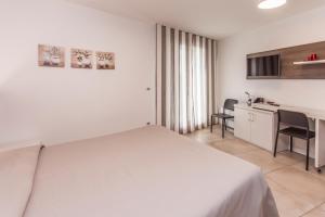 Kuchyň nebo kuchyňský kout v ubytování Hotel Ristorante Cigno - Camere and Aparthotel