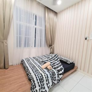 a bedroom with a black and white bed with a window at Bandar Puchong Jaya Skypod B My Guest Homestay 舒适民宿 in Puchong