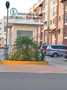 a building with a sign that reads residential personnel buildings at Penthouse with private rooftop near the airport. in La Javilla