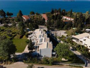 an aerial view of a house with the ocean in the background at MIRAMARE LUXURY APARTMENTS in Eretria +2 photos