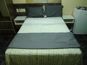 Postelja oz. postelje v sobi nastanitve Hotel Opção