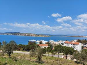 a view of a city and a body of water at Celil Pansiyon in Ayvalık