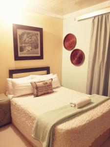 Ένα ή περισσότερα κρεβάτια σε δωμάτιο στο Thokazi Haven Guest House & Backpacker