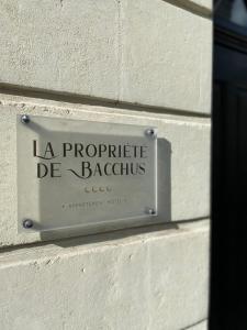 a sign on the side of a building at La Propriete de Bacchus in Saumur