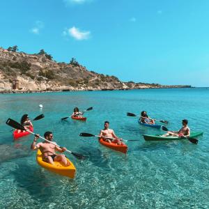 a group of people in kayaks in the water at Proteas Mare Suites in Protaras