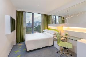 Cama o camas de una habitación en Dorsett Tsuen Wan, Hong Kong