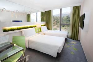 Cama o camas de una habitación en Dorsett Tsuen Wan, Hong Kong