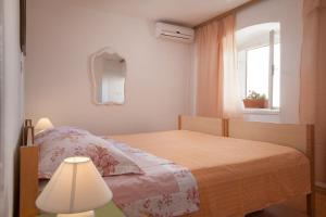 Cama ou camas em um quarto em Apartments Jelka