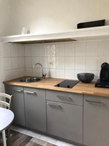 a kitchen with a sink and a counter top at Little GAMBETTA in Saumur