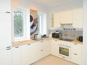 Kuchyňa alebo kuchynka v ubytovaní Hornigold Apartament Gdynia