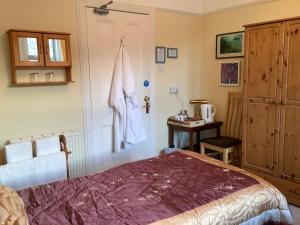 Postel nebo postele na pokoji v ubytování Struan House B&B