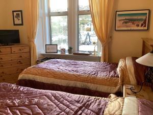 Postel nebo postele na pokoji v ubytování Struan House B&B