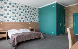 Ένα ή περισσότερα κρεβάτια σε δωμάτιο στο Matisov Domik Hotel near New Holland Island