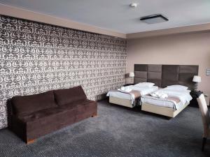 Postel nebo postele na pokoji v ubytování Hotel Jedlinka