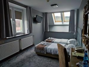Postel nebo postele na pokoji v ubytování Hotel Jedlinka