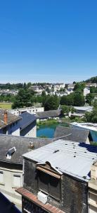 an aerial view of roofs of buildings with a pool at Location G&W, très proche sanctuaires in Lourdes