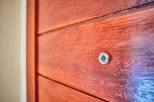 a close up of a wooden door with a knob at Budchui Village2 in Koh Tao