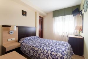 Hotel Canaima Bruma 1,5 k Caminoにあるベッド
