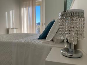Кровать или кровати в номере Taonasi Mazzarò Apartments