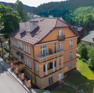 an aerial view of a house with a roof at Stella in Krynica Zdrój